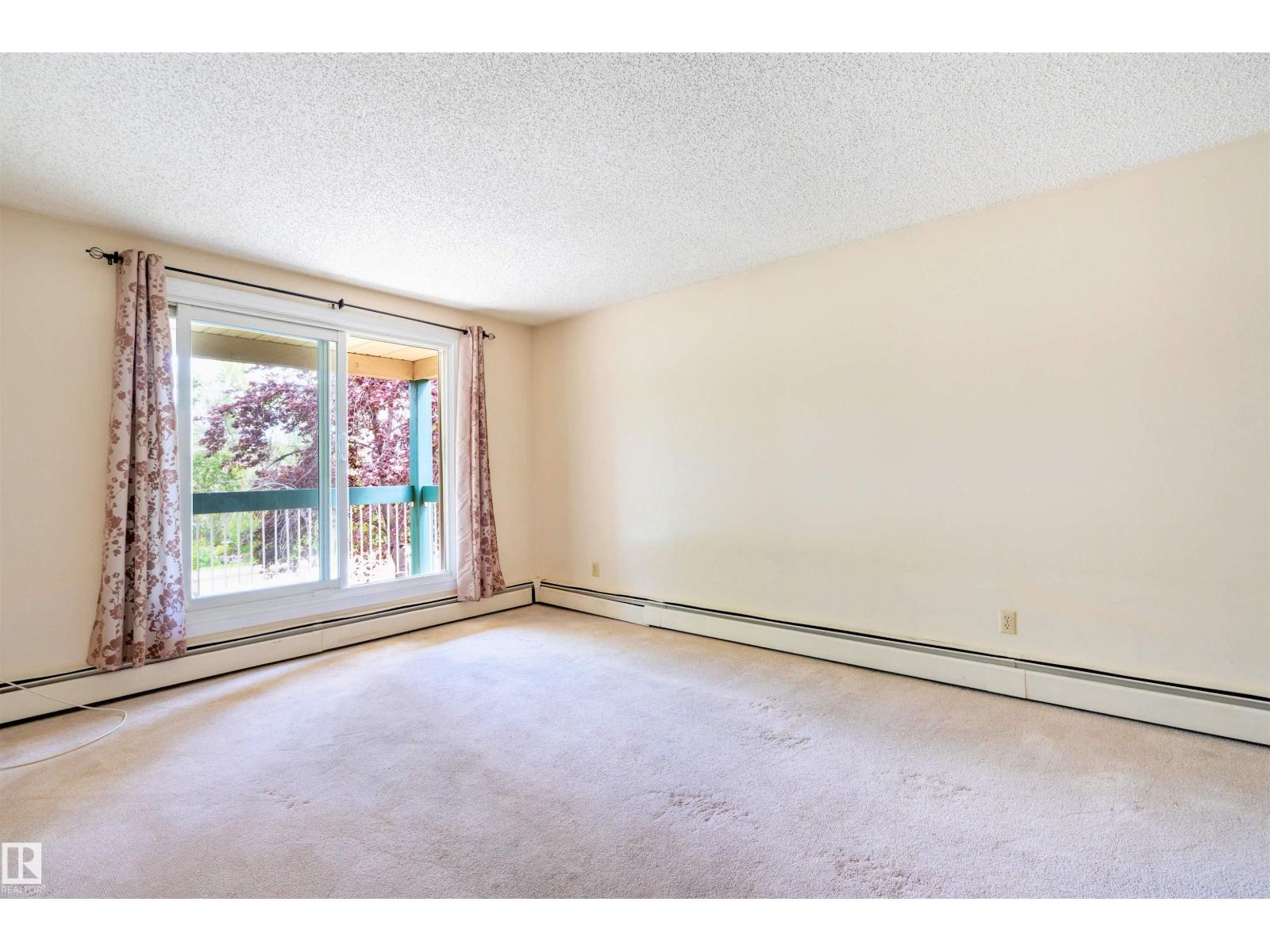 #203 1628 48 ST NW