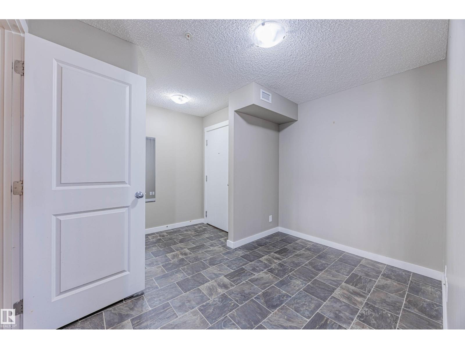 #202 5816 MULLEN PL NW