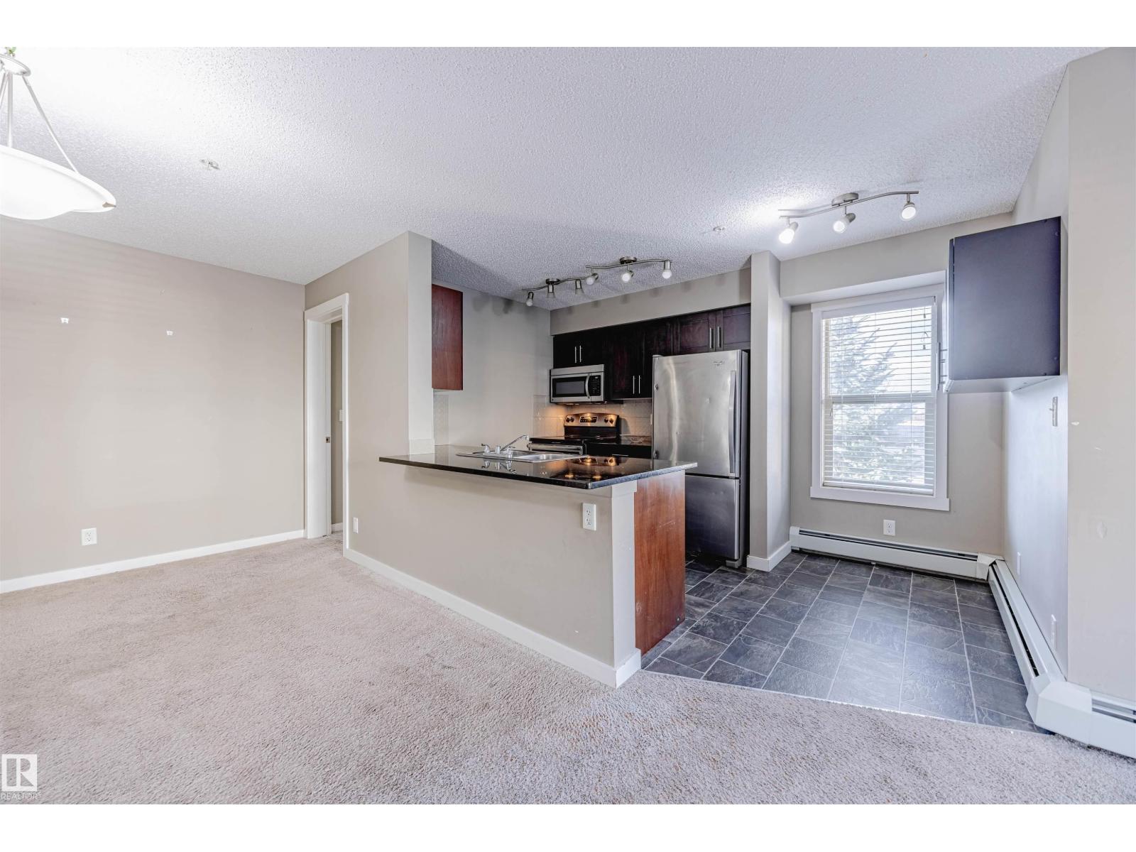 #202 5816 MULLEN PL NW