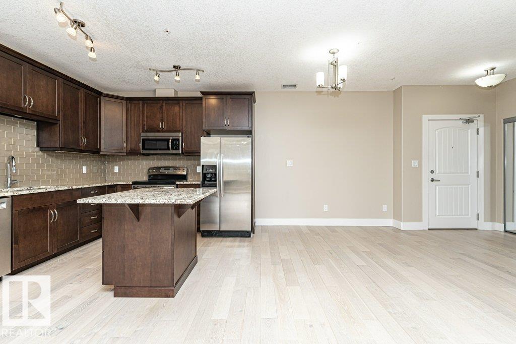 #256 6079 MAYNARD WY NW