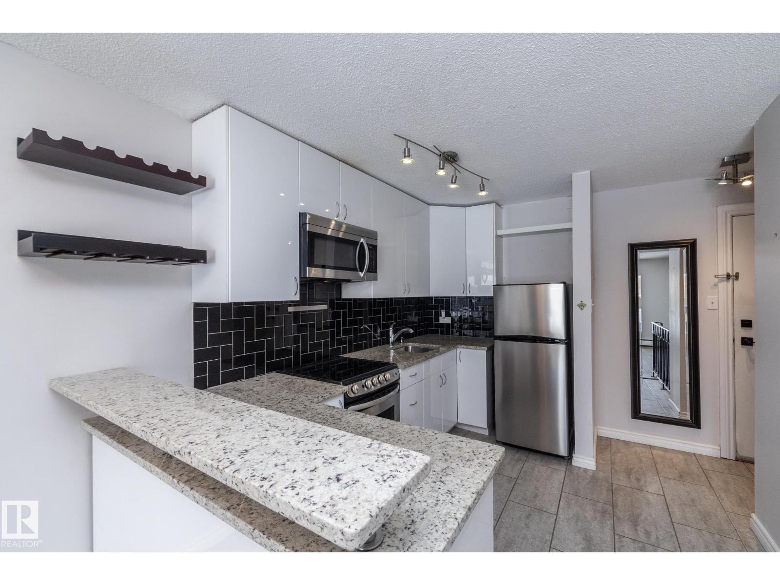 #104 11429 124 ST NW