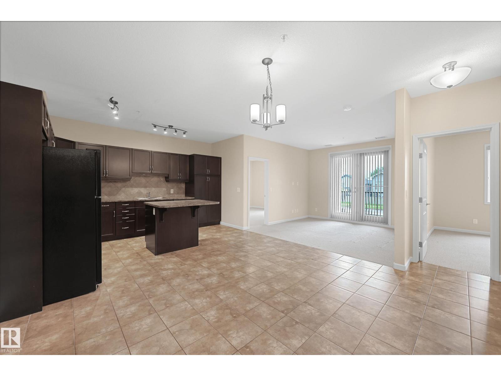 #216 6083 MAYNARD WY NW
