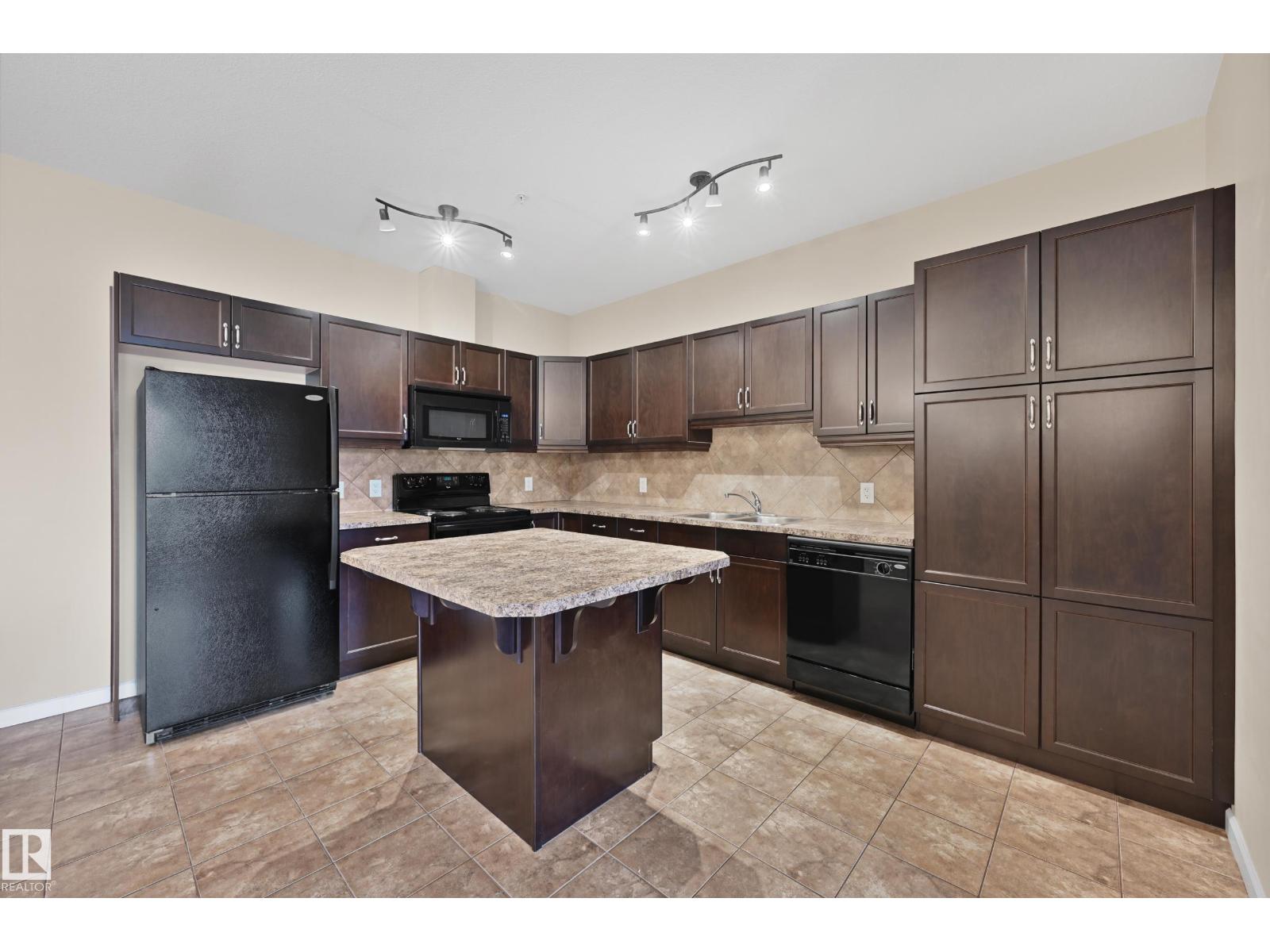 #216 6083 MAYNARD WY NW