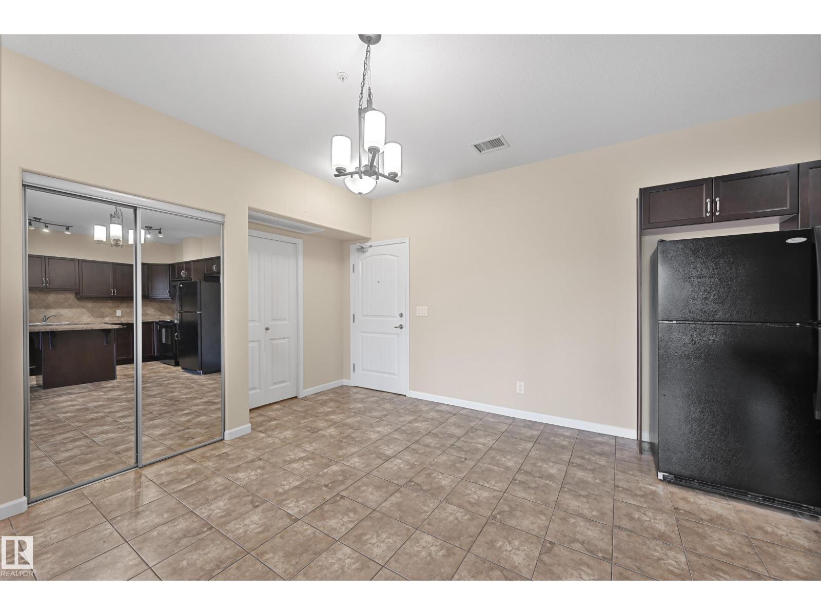 #216 6083 MAYNARD WY NW