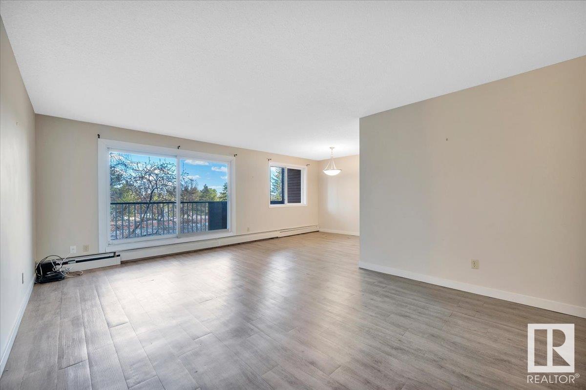 #211 5520 RIVERBEND RD NW