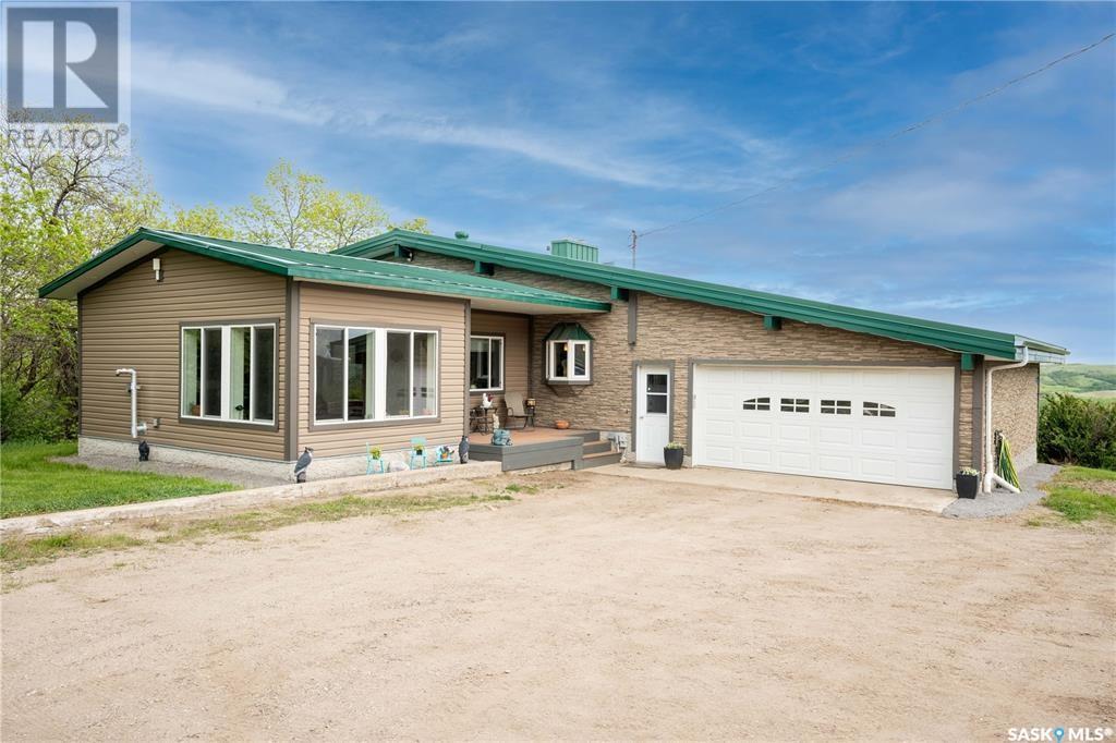 Lumsden acreage with outbuildings