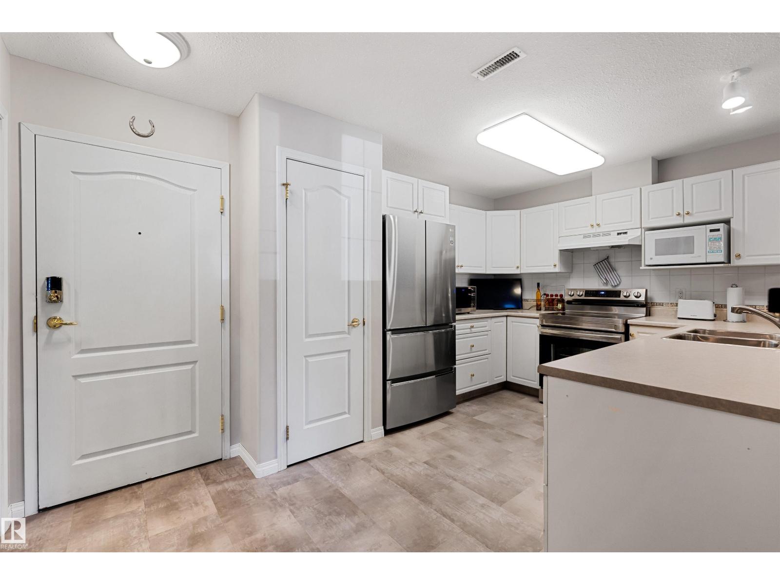 #112 237 YOUVILLE DR E NW