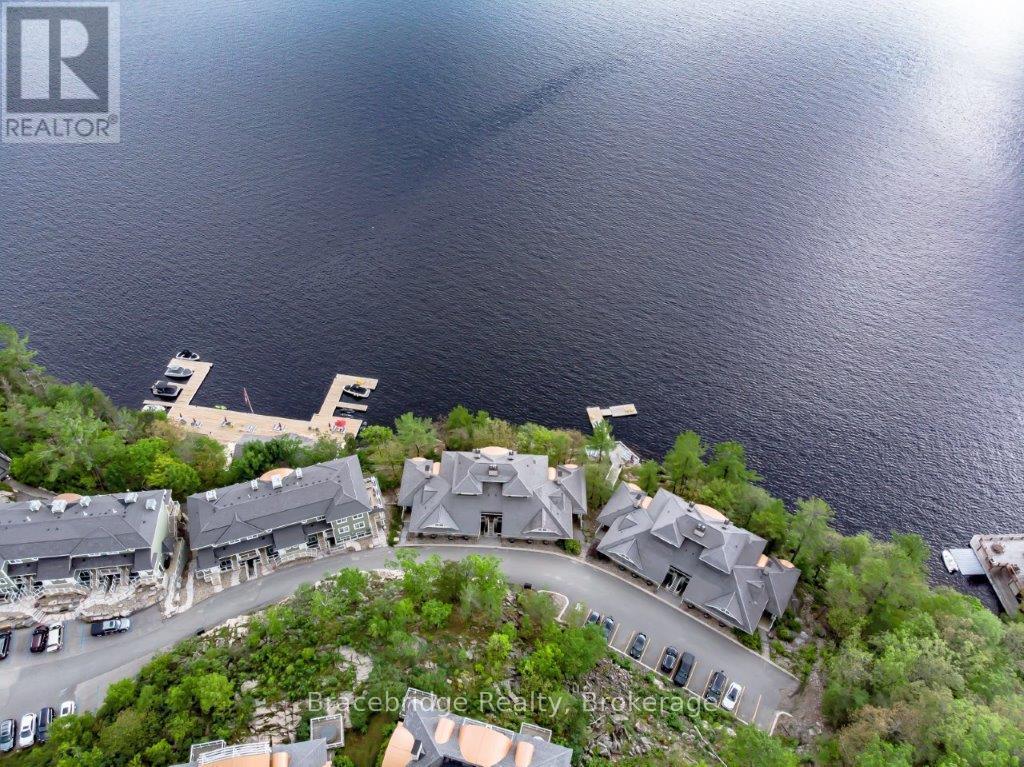 Photo 1 of 26 — A201-D1 - 1869 MUSKOKA RD 118 HIGHWAY W Unit A201-D1, Muskoka Lakes (Monck (Muskoka Lakes)), ON P1L1W8