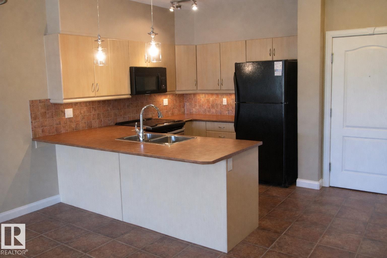 #310 1406 hodgson way NW