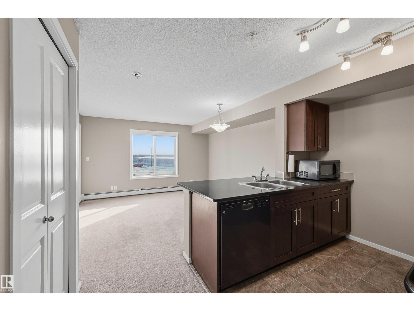 #208 5810 MULLEN PL NW