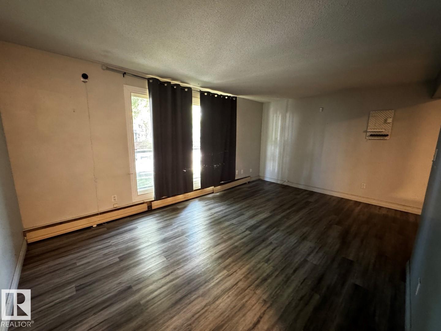 #203 10415 93 ST NW