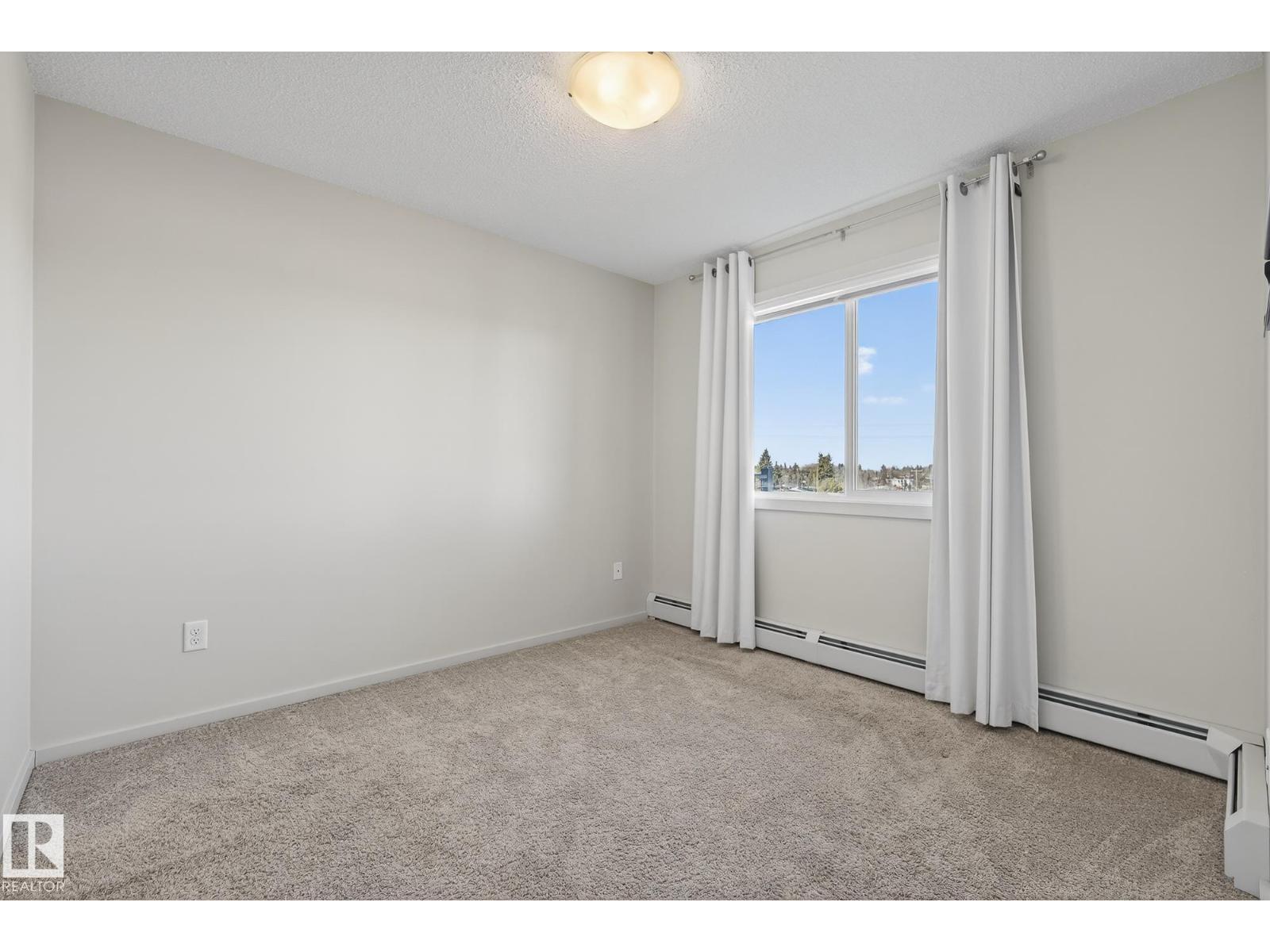 #405 7711 71 ST NW