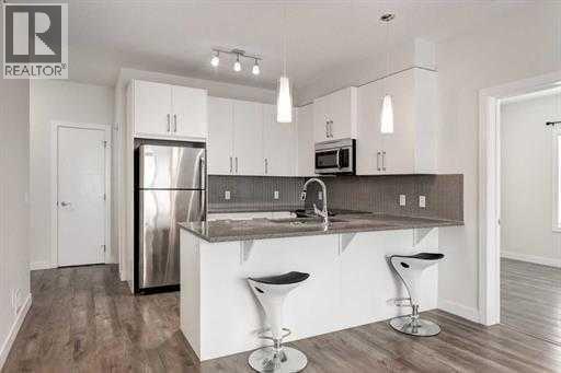 313, 12 Sage Hill Terrace NW