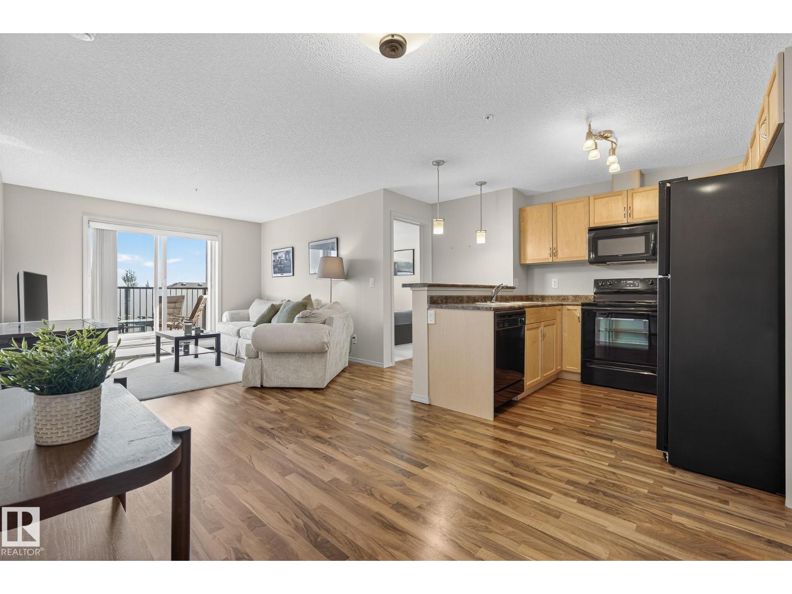 #310 6070 SCHONSEE WY NW