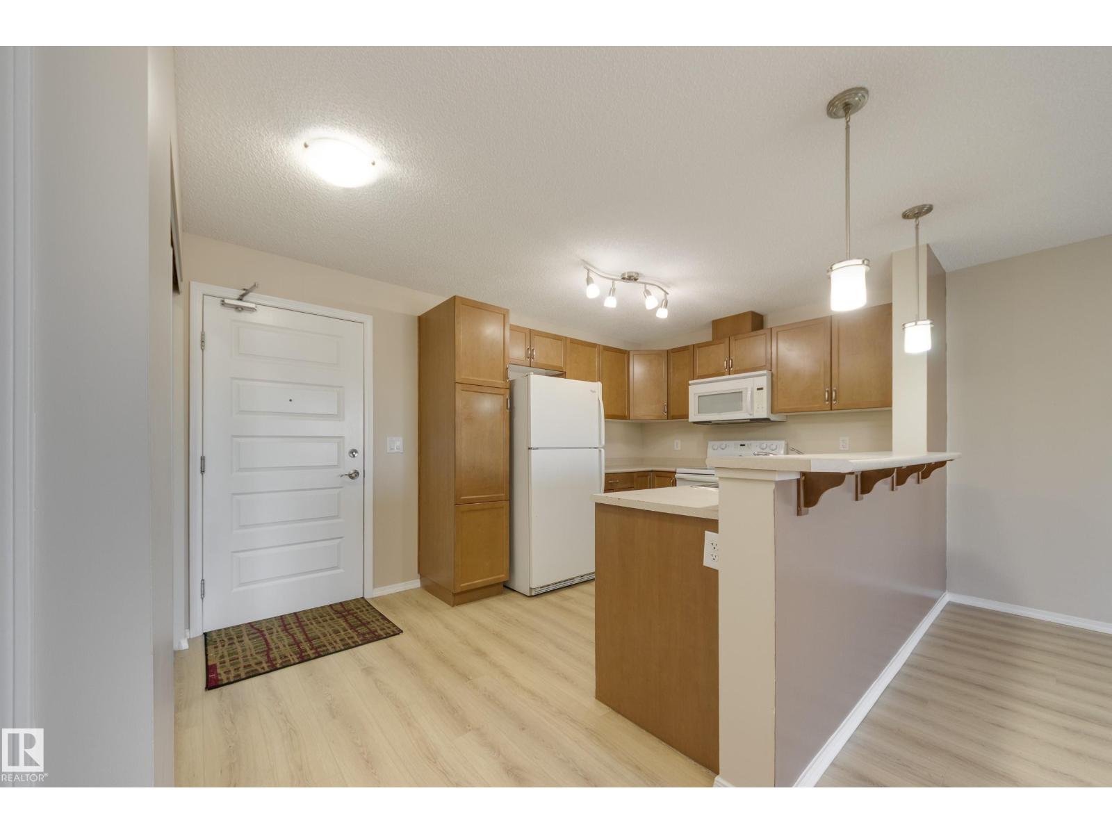 #404 6070 SCHONSEE WY NW