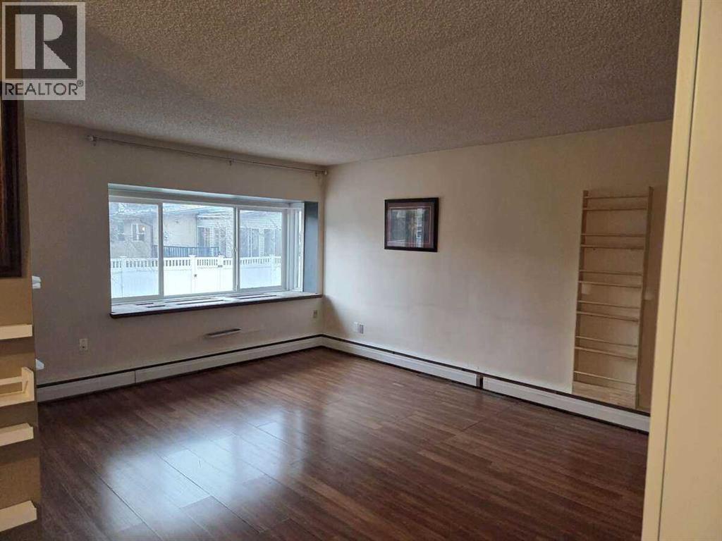 221, 8235 Elbow Drive SW