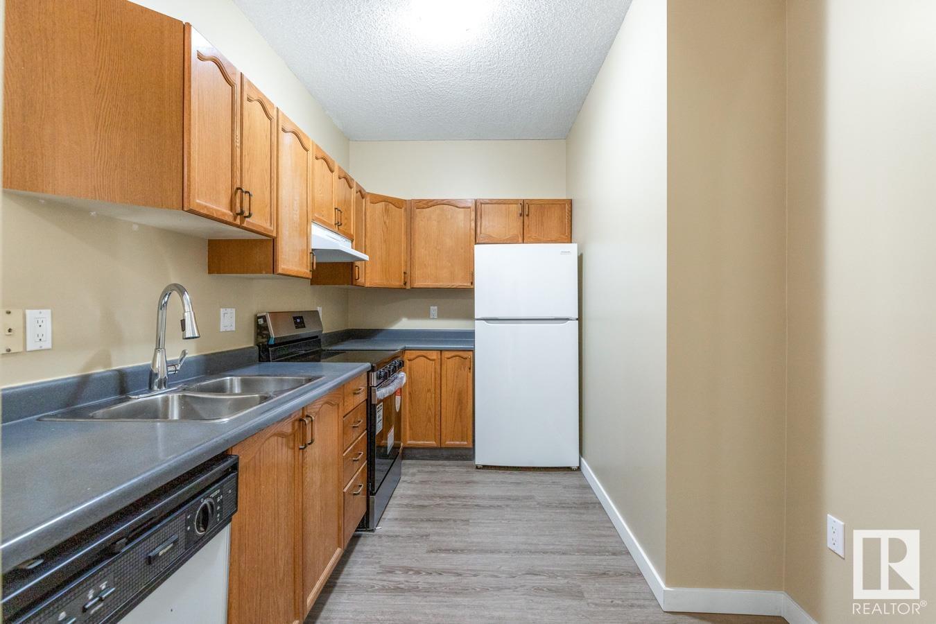 #216 15499 CASTLE DOWNS RD NW