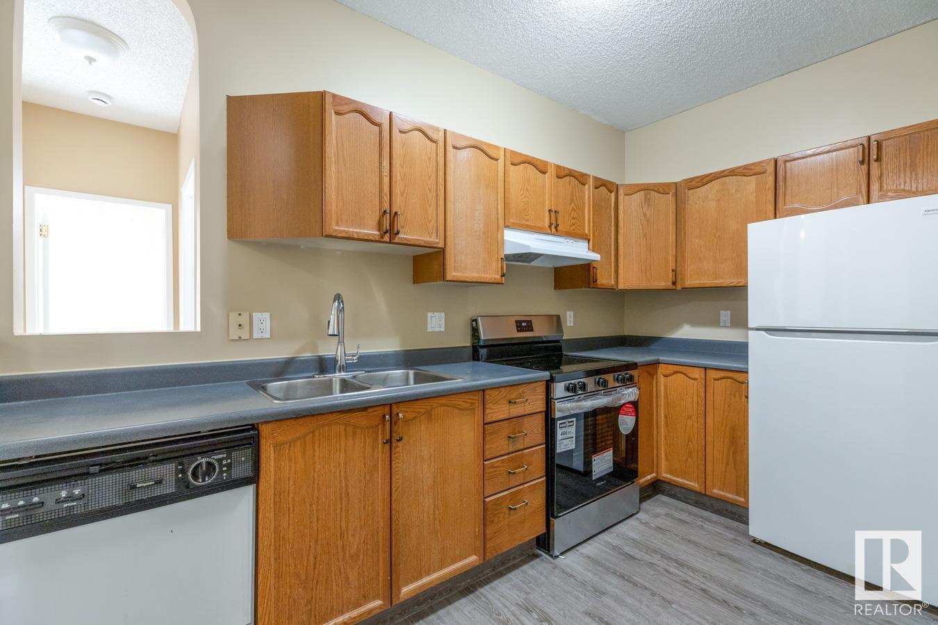 #216 15499 CASTLE DOWNS RD NW