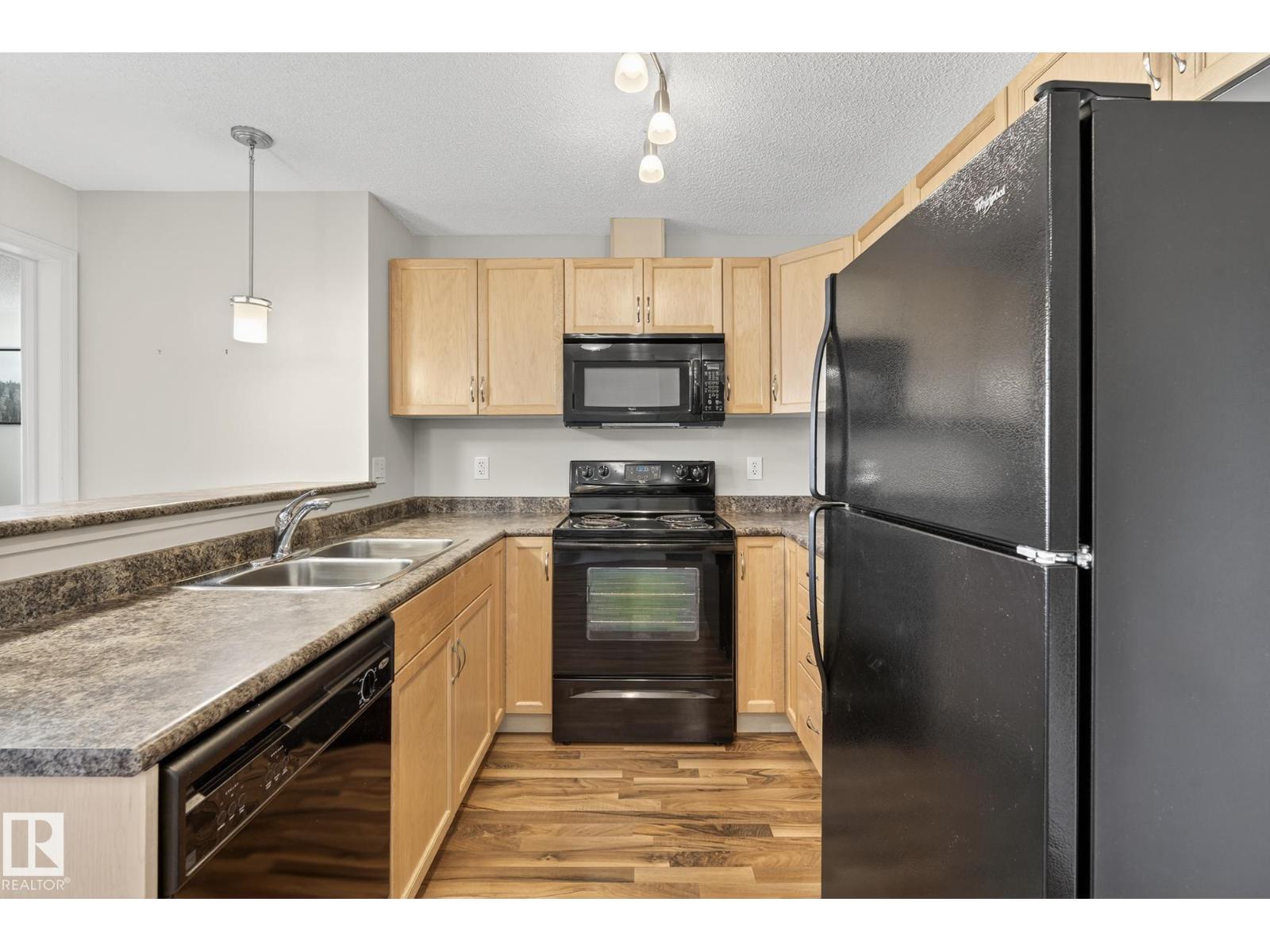 #310 6070 SCHONSEE WY NW