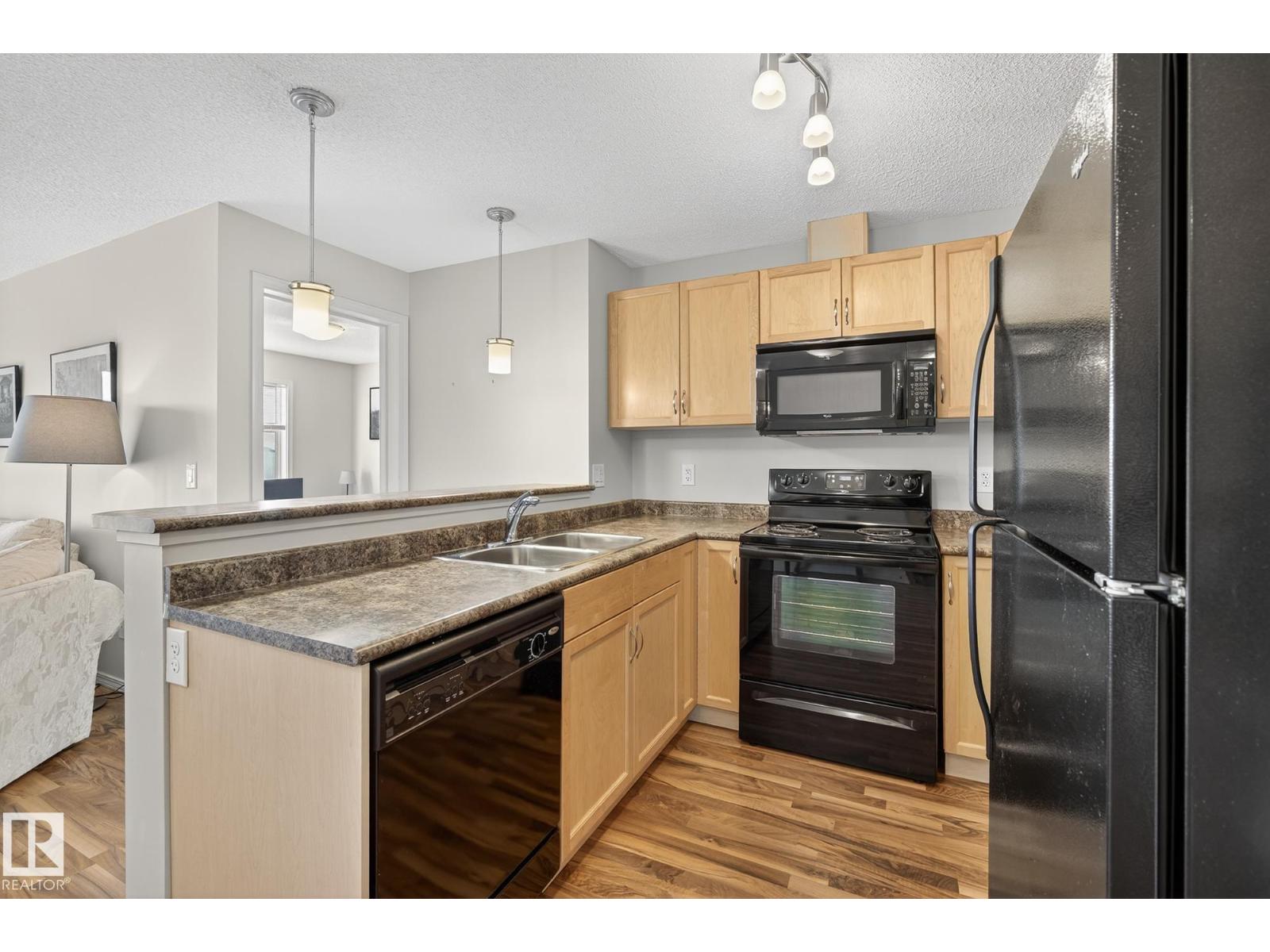 #310 6070 SCHONSEE WY NW