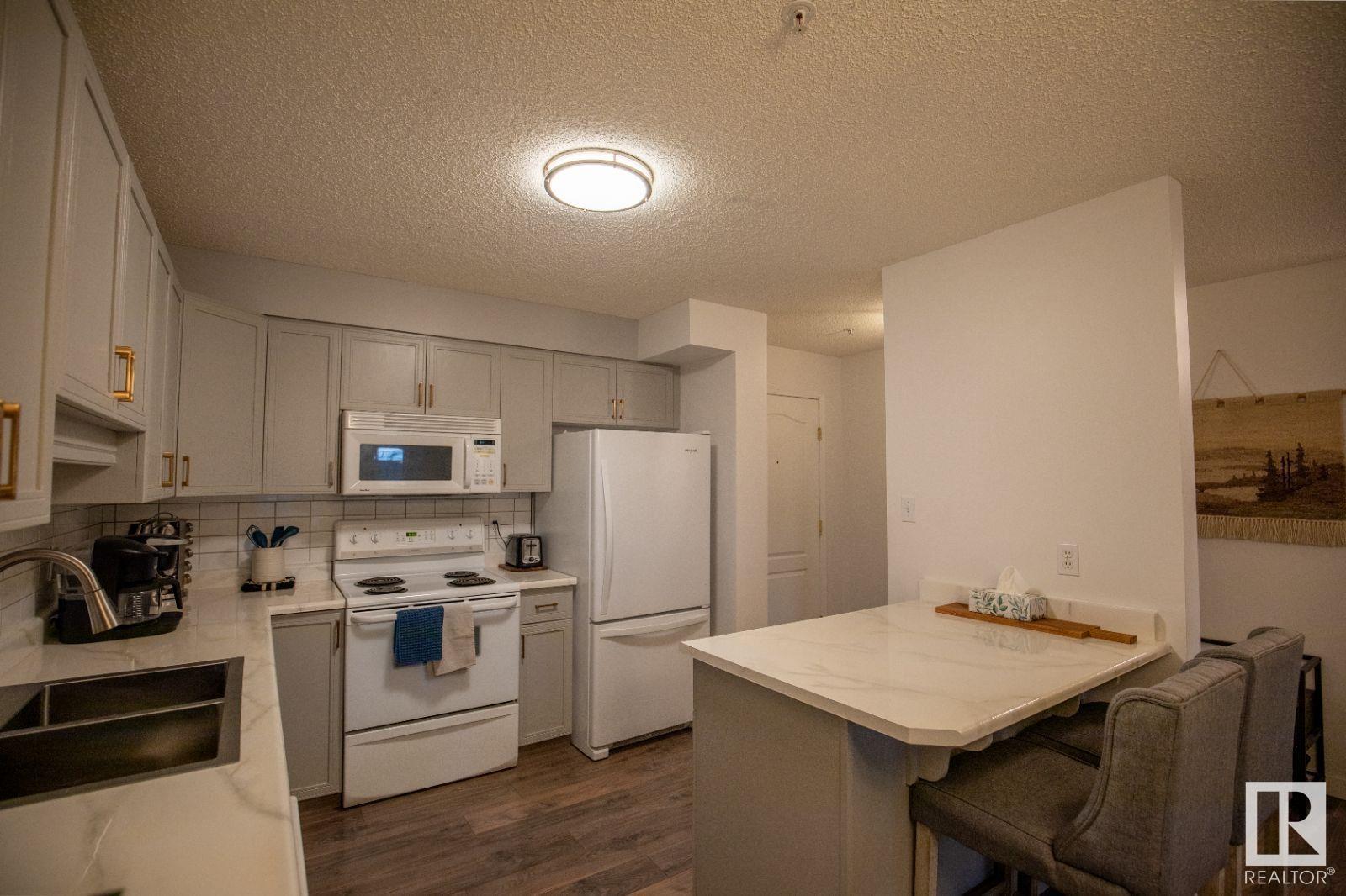 #104 8909 100 ST NW