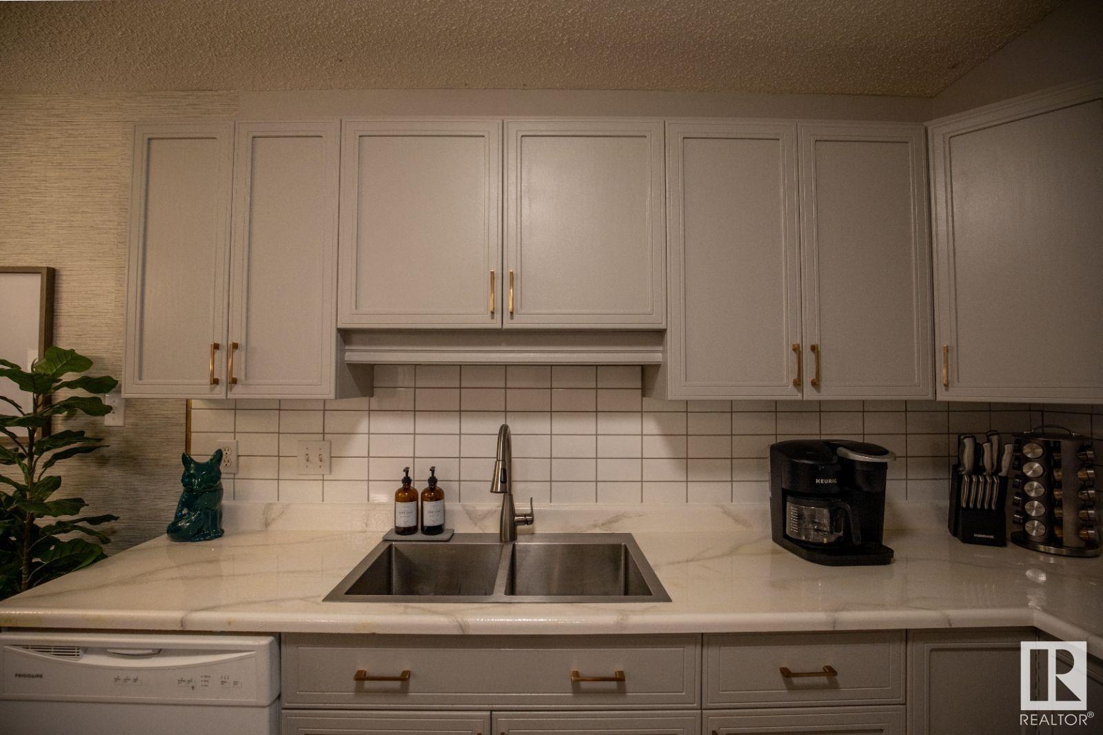 #104 8909 100 ST NW