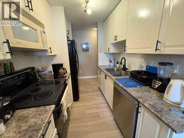 703, 11620 Elbow Drive SW