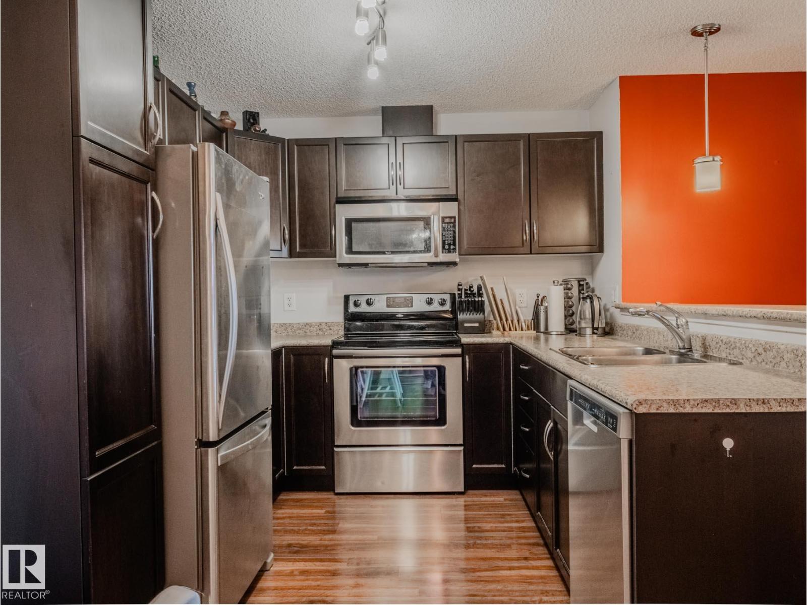 #409 6070 SCHONSEE WY NW