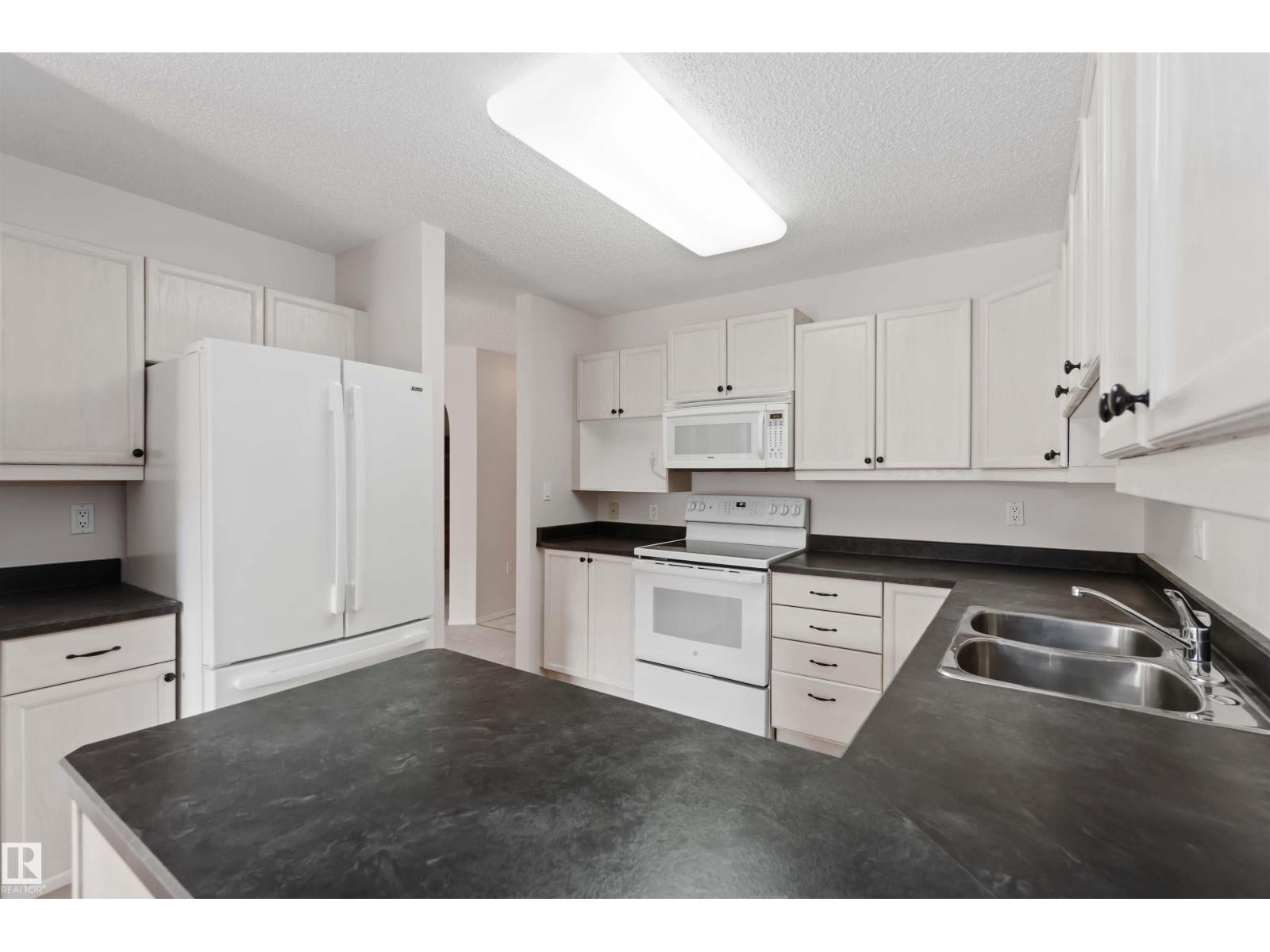 #312 15499 CASTLE DOWNS RD NW