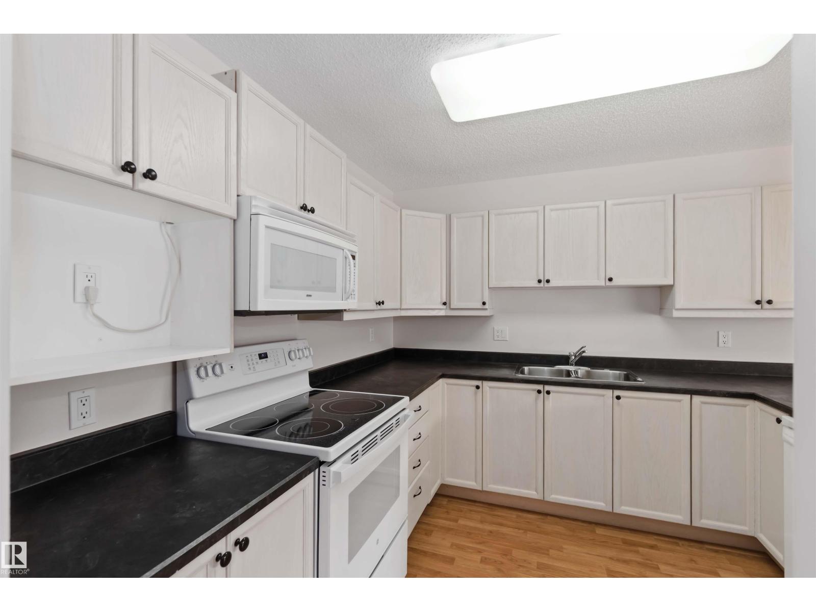 #312 15499 CASTLE DOWNS RD NW