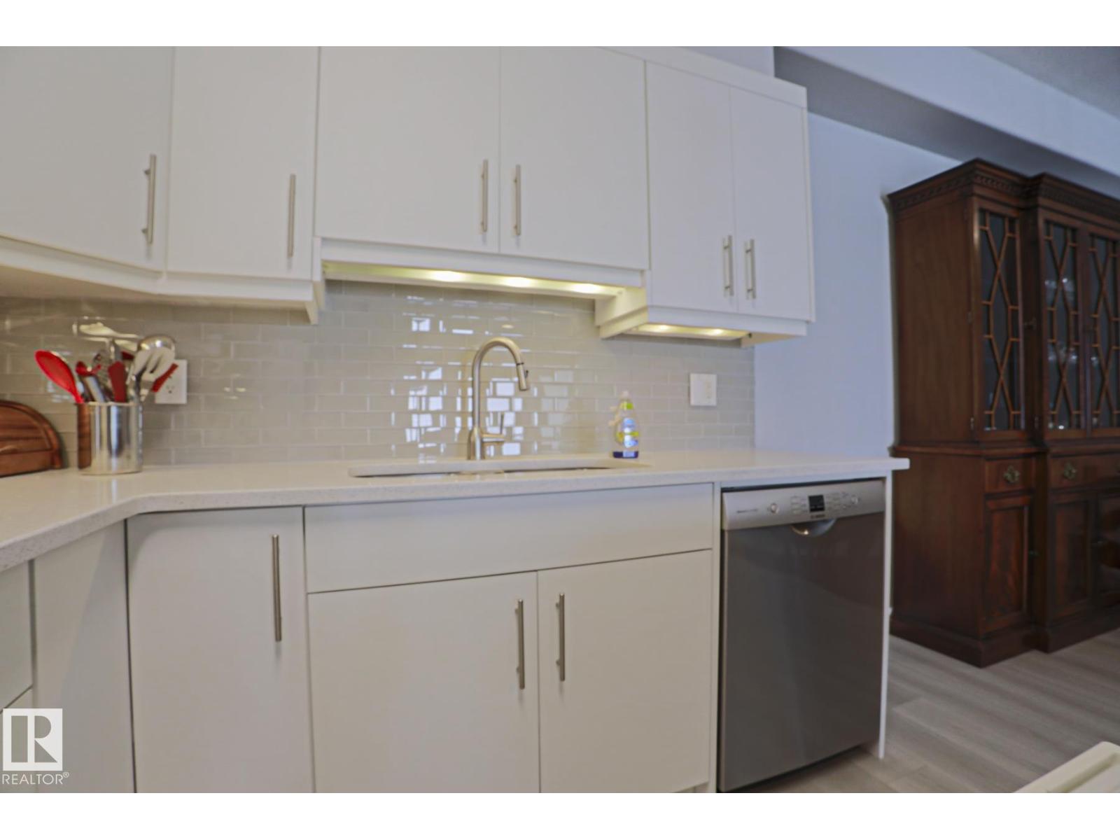 #432 1406 HODGSON WY NW