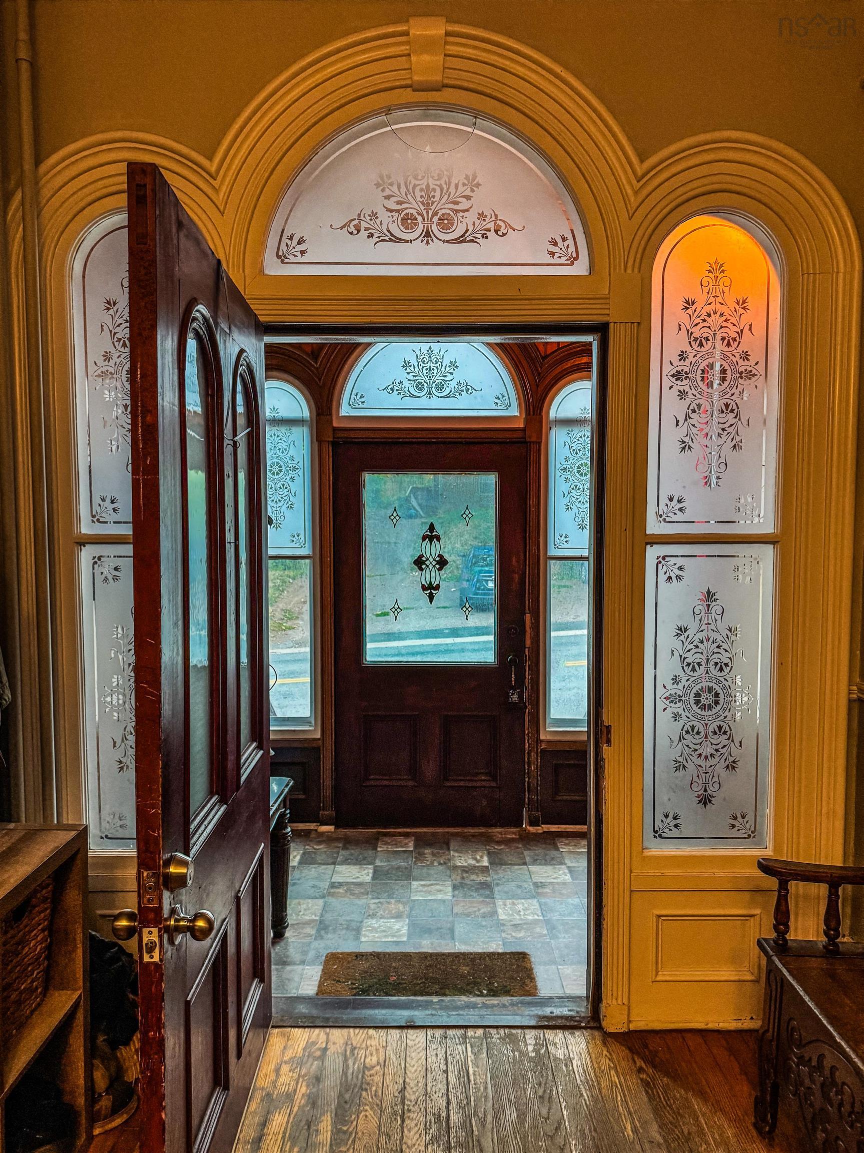 Foyer entrance with hardwood / wood-style floors