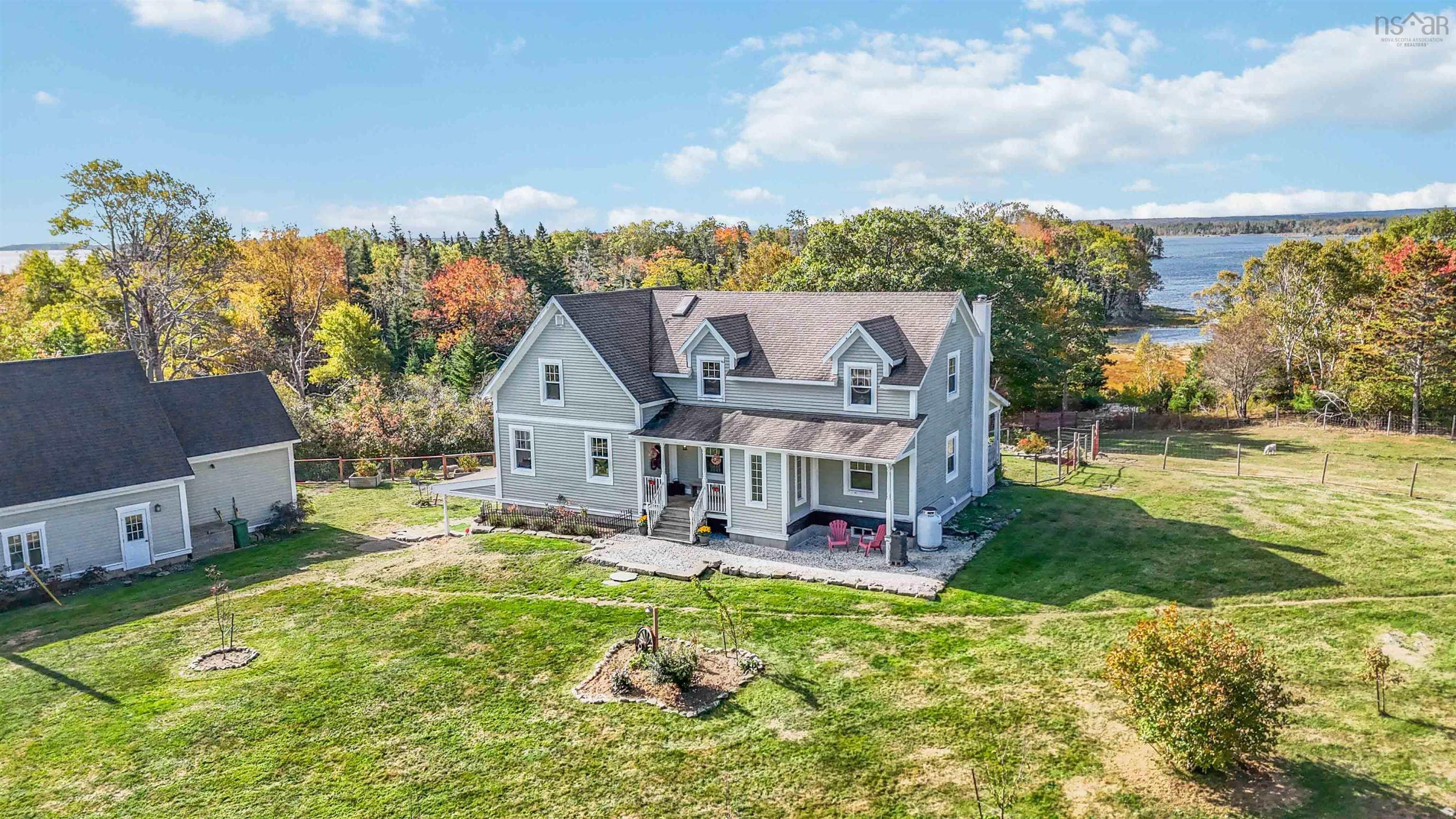 Waterfront, 4 bedrooms, 3 bathrooms. Detached garage with attached 1 bedroom 1 bath cottage.