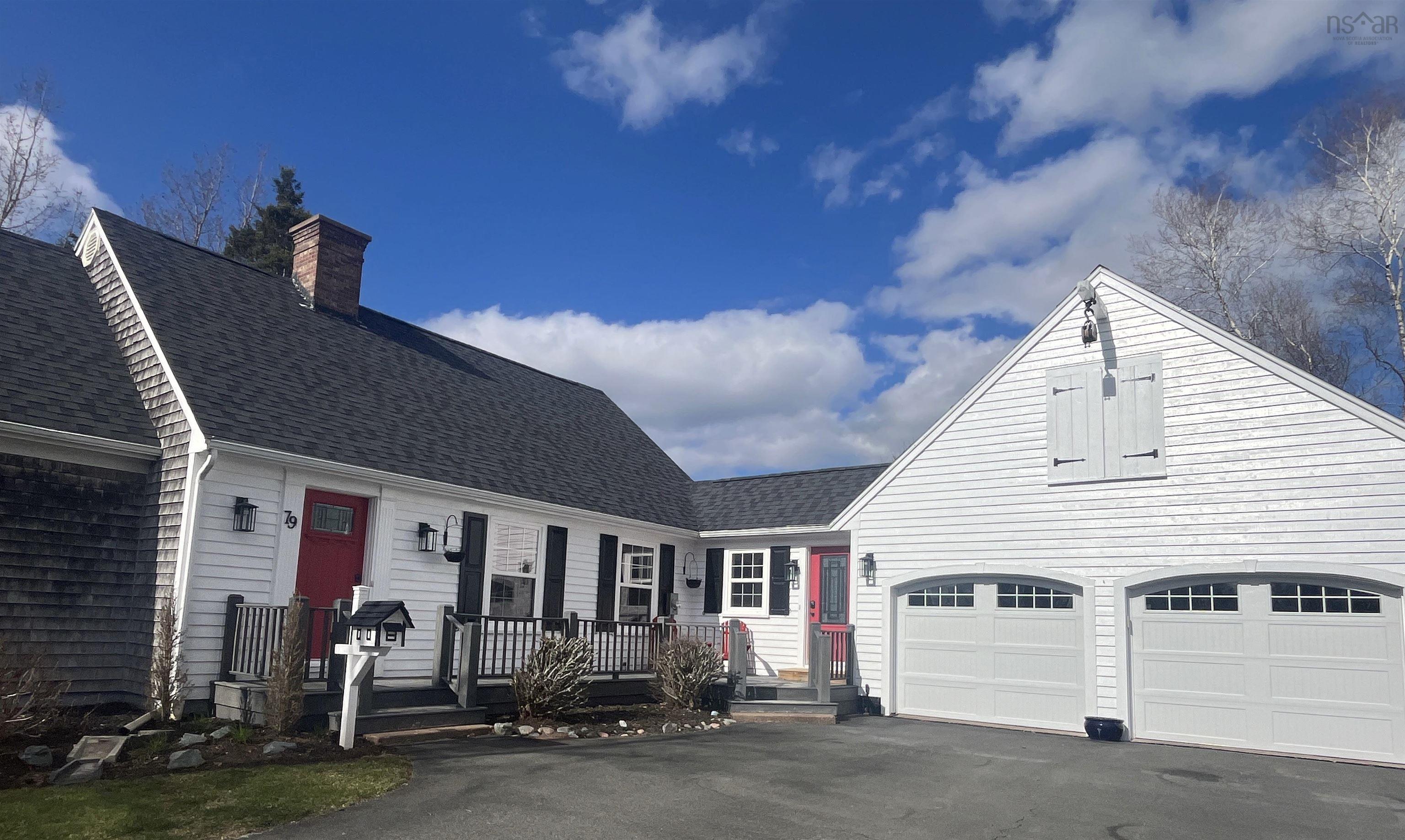 Asphalt shingle roofline with a brick chimney