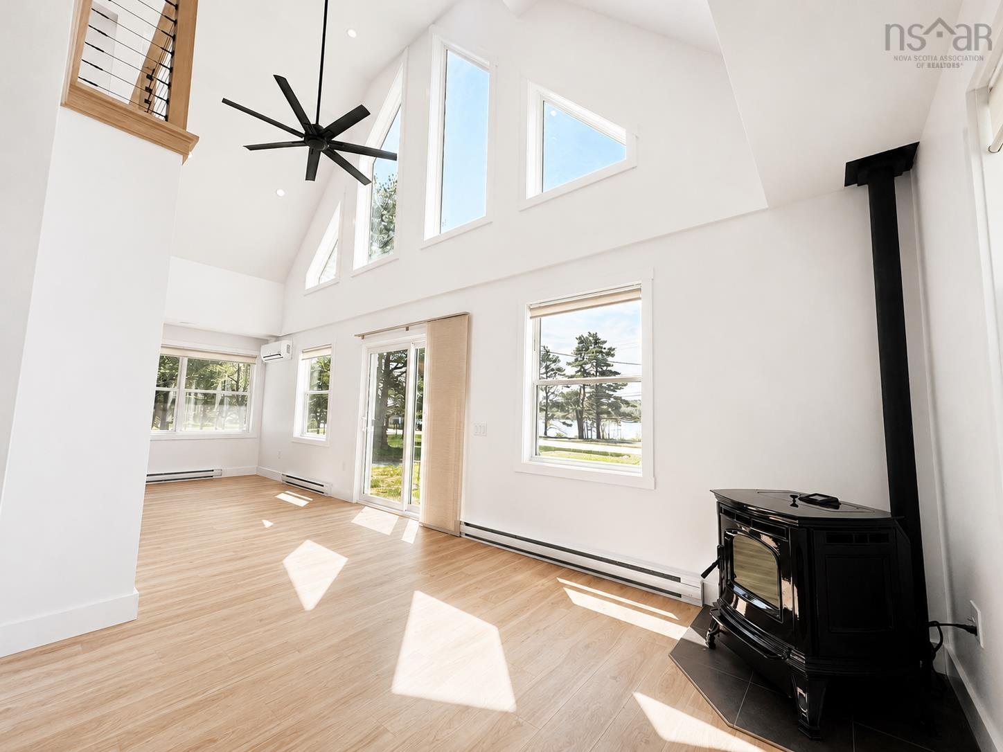 Vaulted ceiling with a contemporary black ceiling fan