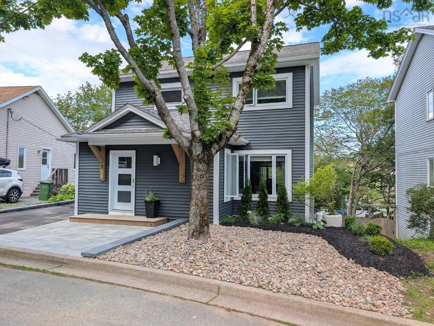 Contemporary two-story exterior with horizontal dark gray siding