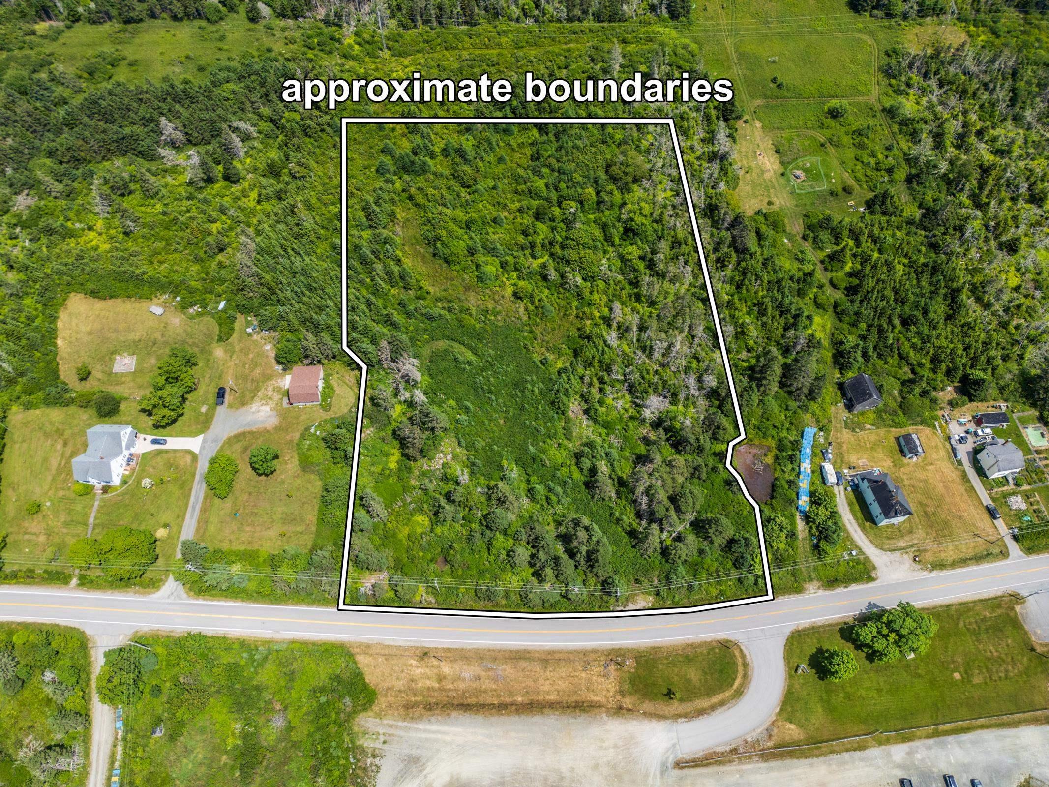 Aerial view of property and surrounding area with property parcel outlined