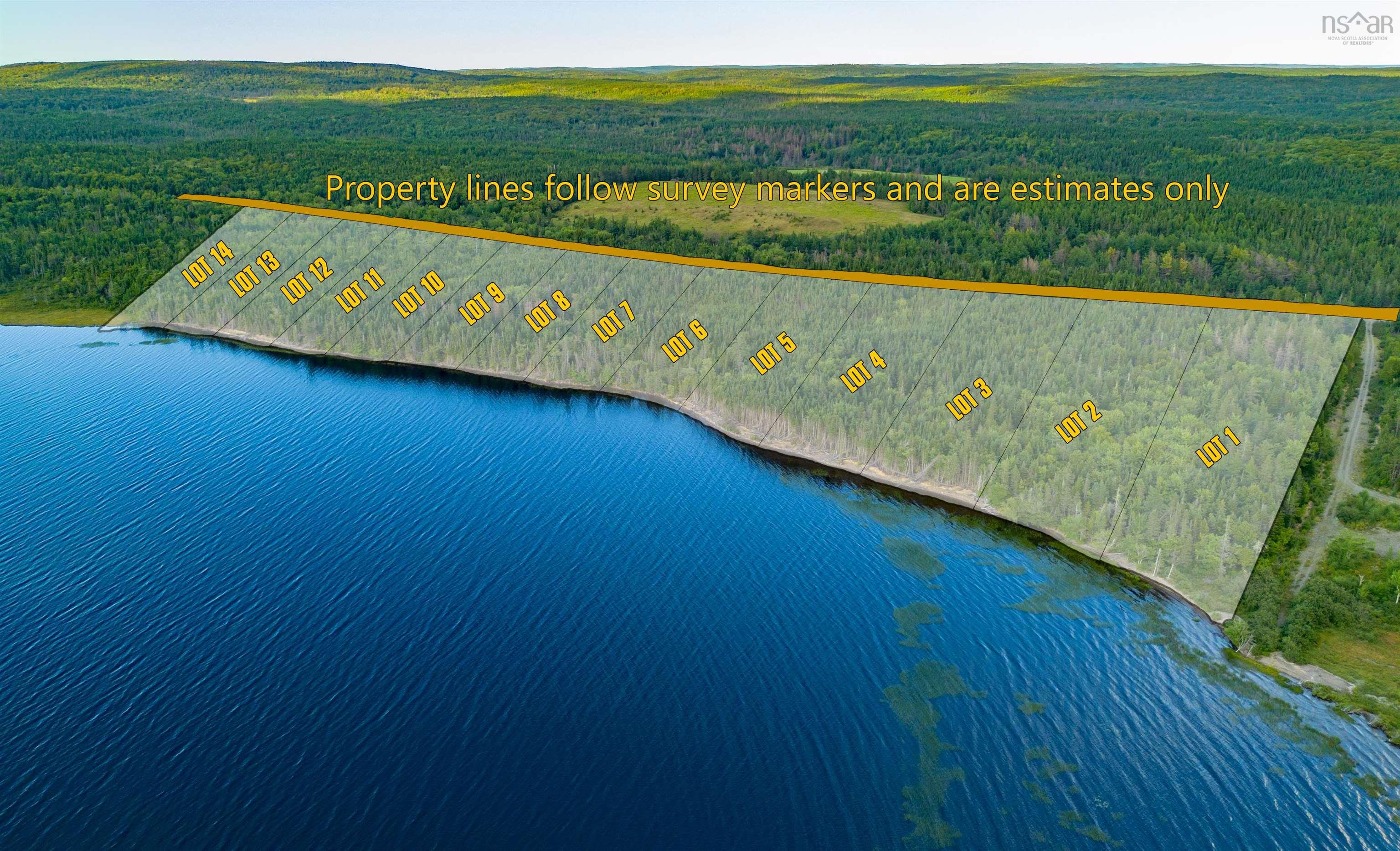 Aerial overview of property's location featuring a large body of water and property parcel outlined