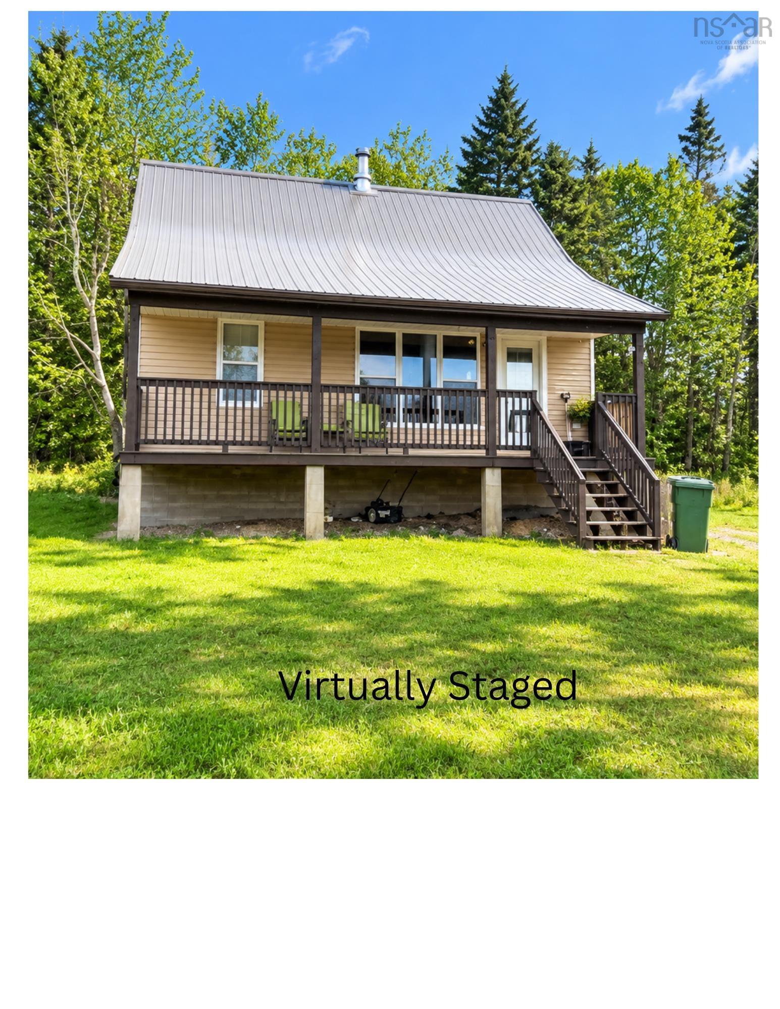View of front of home with a metal roof and a porch