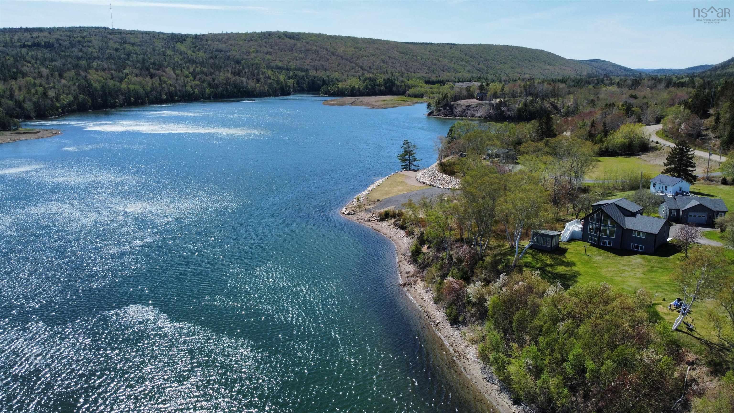 View from above of property with a nearby body of water