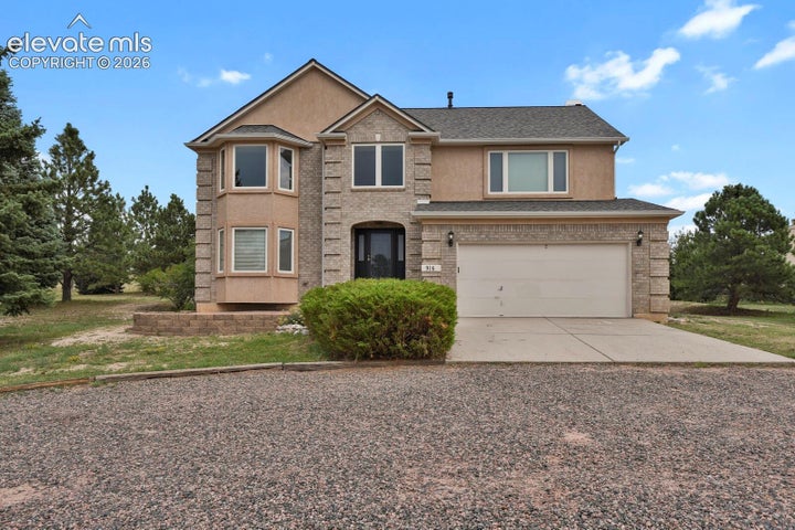 Low maintenance exterior with brick & stucco