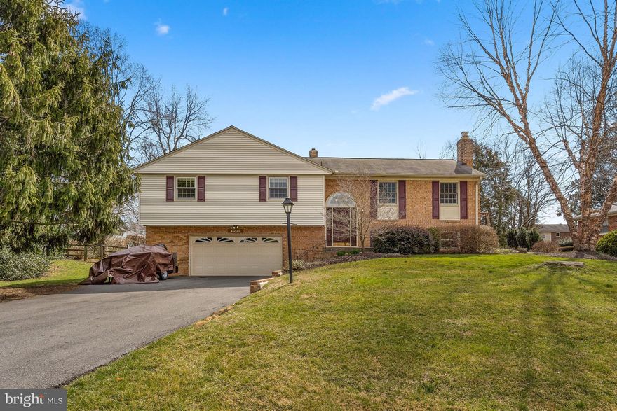 Beautifully remodeled & renovated 4 bedroom, 3 bath Greenbriar Model with sun room addition. This home  features a gourmet kitchen with granite counters, custom cherry cabinets, top of the line stainless steel appliances and hardwood floors. Living room & dining room with hardwood floors open to sun room addition, perfect for entertaining! Owner's suite with private full bath & hardwood floors. Gorgeous IPE deck off sun room  to large level backyard. The lower level features a family room with brick surround gas fireplace, laundry room and additional full bath. Park your car in the oversized 2 car garage with storage space & side exterior door.  This home shows like a model with every detail tastefully and thoughtfully addressed!