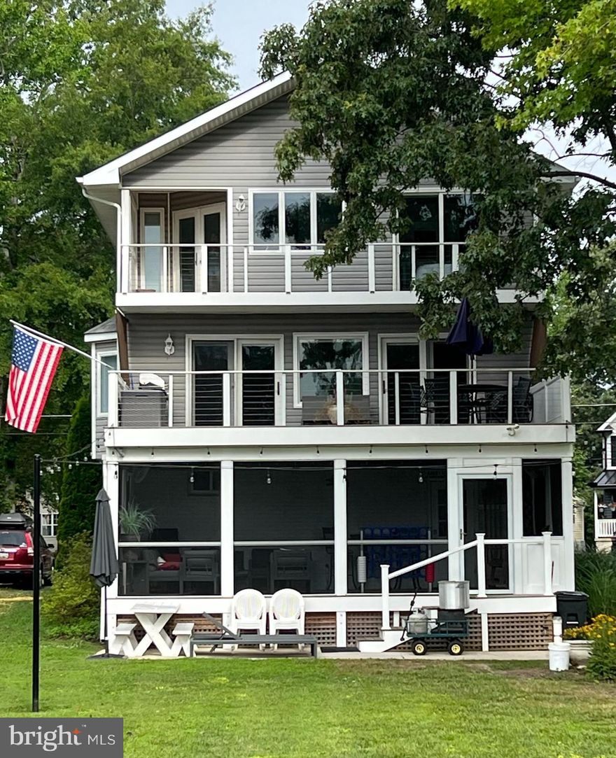 What's not to love?  Wake to sunrise on the beautiful South Creek, just off of the West River and Chesapeake Bay.  Imagine  your favorite morning beverage, prepared fresh in your primary suite ( includes full bath and sitting area), and enjoyed  from the upper level deck while taking in the views.  A second bedroom with it's own full bath completes the upper level. The main level  - features the  marble countered kitchen with stainless steel appliances, living and dining areas and a third bedroom with full bath, plus a convenient half bath, with magnificent view of the water, and a second large deck. Ground level delivers a massive screened in porch  (NEW ) with metal roof, two car garage, featuring  epoxy coated floor,  with storage and a workshop PLUS a full bath for cleaning up after a day on the water.
Just a few steps to the pier, with a 5,000 pound boat lift, THREE PWC lifts, and water hook up  for easy cleanup of your water toys and the day's catch of crabs and fish.
The home features hardwood floors, custom lighting and three NEW Full baths
NEW Kitchen
NEW Exterior Stairway
Pier NEW in 2015
Picture yourself here!