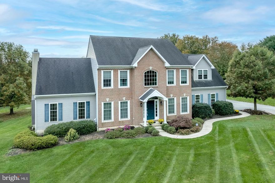 Pride of ownership abounds! With a peaceful and private setting, on a cul de sac lot in the desirable Barnsgate neighborhood, this 4BR 3.5 BA home is move in ready and has easy access to schools, shopping, and commuter routes. Welcomed by a meandering front path, this brick façade classic home features an open concept floor plan with large eat-in kitchen and huge family room at the heart of the home. The kitchen offers loads of counter space, propane range cooking, stainless steel refrigerator, Bosch dishwasher, stainless double bowl sink, and sunny breakfast area with French doors to the deck and views to the rear yard and private views behind. The large family room features a wood burning floor to ceiling stone fireplace and is perfect for a quiet cozy evening or entertaining. The first floor also includes a formal dining room with chair rail and crown molding, a front living room which would make the perfect first floor office, a huge laundry room with closet, shelving, utility sink and bright sunny window, powder room, and interior access to the oversized 3-car garage. The second floor features a primary bedroom sanctuary with a huge bedroom with tray ceiling, separate spacious sitting room (perfect for office or nursery), en suite bathroom with double sink vanity, tiled floor, soaking tub, stall shower, and walk-in closet.  Three additional spacious bedrooms and a full hall bath complete the second level. The partially finished basement is HUGE with walk-out onto a large paver patio with access to a newly surfaced deck that had been used for a hot tub.  The huge rear yard is very private, with views of wooded area beyond.  A spacious shed has been customized with electric service. This is an wonderful home with great floor plan flow and space, large private yard on a cul de sac lot, and close to everything.  Come see the tremendous value in this home!