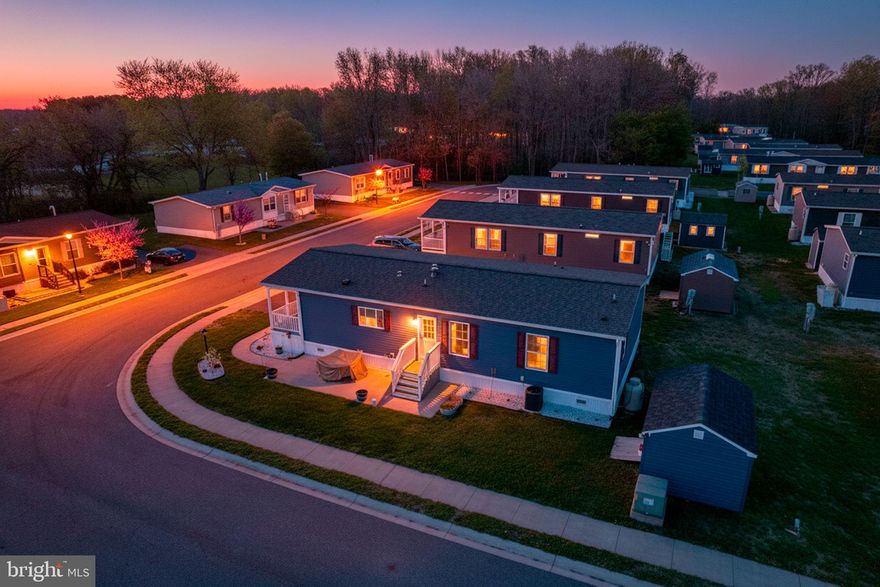 Looking for an affordable, new home without the wait? Here's your chance! This home is less than 3 years young, in the quiet 55+, highly secluded rear section of Ridgewood Manor, just off of Rt 13 and close to shopping & healthcare.  The corner, premium lot features a custom ordered 14x10 shed to perfectly match the home. Sit back and relax with your morning coffee on the low-maintenance front porch. Upon entering,  you're greeted with a large, open concept floor plan with luxury vinyl plank flooring that is suitable for entertaining when the need arises. The chef's eat-in kitchen features gas cooking, stainless steel appliances, TONS of cabinet space and an island for extra seating and storage. Down the hallway, you'll find the large primary suite that generously accommodates a king bed with an en-suite full bathroom and spacious walk-in closet. There are two additional bedrooms, along with a second full bathroom for guests. This home was built in 2023, which means roof and all mechanicals are like-new. If you're seeking less maintenance and peace and quiet, this is the home for you! Schedule your private tour today. *Please note, current lot rent is $766.36/month. Lease renews June 1'st each year. All offers are subject to park approval.*