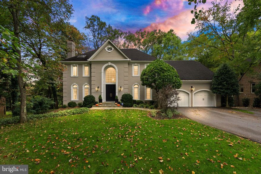 Nestled in the heart of Heritage Farm, steps from Potomac Village, this beautifully designed and updated home offers an exceptional blend of elegance, comfort, and charm. From the moment you arrive, the meticulous curb appeal and garden-like backyard evoke the feel of an English countryside retreat. A detached post-and-beam two-story structure can accommodate a boat, vintage cars or a golf simulator and provides additional storage space. Step inside the grand foyer with luxurious marble floors, and you’ll be welcomed into formal living spaces that invite warmth and relaxation. The foyer opens to both the formal living room—featuring a cozy fireplace—and the spacious dining room, perfect for hosting family gatherings. The kitchen is a chef’s dream with custom cabinetry throughout, including panels that cover the Sub-Zero refrigerator and Bosch dishwasher. Other appliances include a Wolf induction cooktop and oven, a microwave drawer and a Zephyr wine fridge. Skylights, marble backsplashes and a soapstone countertop enhance the kitchen’s beauty. The kitchen flows seamlessly into the family room, where you’ll find a custom designed wet bar with a copper sink, a cozy fireplace, and coffered ceilings. A custom island between the kitchen and family room offers a multifunctional transition between kitchen and family room, but can be removed if the new owners prefer. Off the family room is a bright and airy sunroom with vaulted ceilings for a year-round retreat.  Both the sunroom and kitchen open to a deck designed with seamless planks for a sleek outdoor space. The main level also includes a powder room and a formal office featuring a tray ceiling, built-in shelves and plantation shutters.
Upstairs, the primary suite impresses with vaulted ceilings, a private fireplace, and a changing room that affords ample closet space and can function as a reading room or an infant’s nursery. The ensuite bathroom offers double vanities, a walk-in shower, and a private water closet. Three additional bedrooms complete this level: two share a Jack-and-Jill bathroom with separate vanities and a bathtub with custom tile surround, while the third bedroom features its own ensuite bath with a modern vanity and tastefully designed tiled walk-in shower.
The walk-out lower level offers a perfect blend of entertainment and functionality, with a fifth bedroom and adjoining bathroom ideal for an au pair or visiting guests. A fireplace, pool table area, and ample entertainment space make this level a true gathering spot. There is also a large storage room and a utility room with additional storage.
The home’s exterior has been freshly painted in a custom color, and the backyard, with its stone patio and lush landscaping, feels like a private oasis. New garage doors enhance the curb appeal, and the roof has 25 years of life remaining. Located just a short walk from Potomac Village, this home offers the perfect blend of tranquility and community, with access to local shops, events, and gatherings. Thoughtfully updated throughout and meticulously maintained, 9708 Hall Rd is more than just a house—it’s an exceptional place to call home. Schedule your tour today and experience the charm and beauty for yourself!