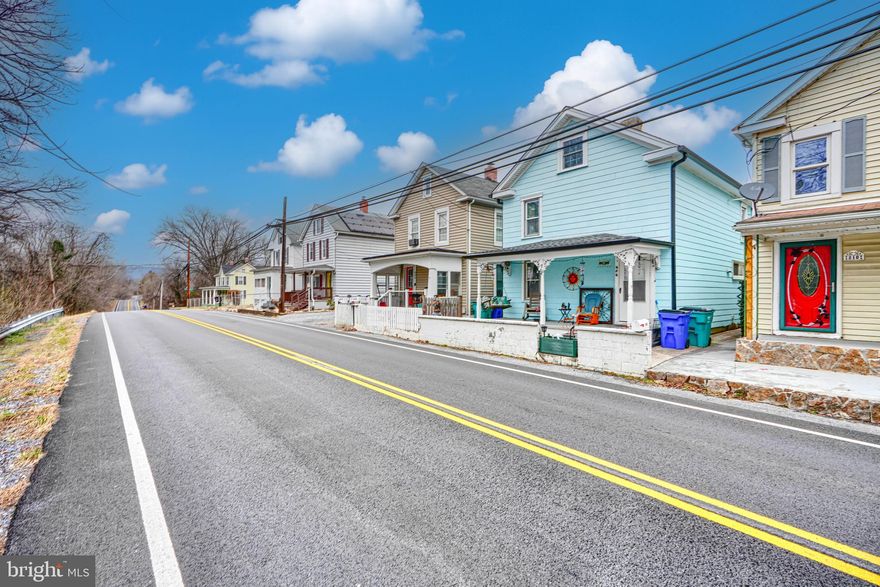 AGENTS - PLEASE VIEW AGENT REMARKS IN BRIGHT MLS. Welcome home to this enchanting retreat that perfectly blends modern updates with a warm, inviting atmosphere, starting with a quaint front porch that offers the perfect spot for your morning coffee. Inside, LVP flooring flows through the main living areas and into an updated kitchen designed for both function and charm, while central heat, air conditioning, and ceiling fans ensure year-round comfort. In addition to the 2 comfortable bedrooms and 1 1/2 baths on the 2nd level, the home boasts a spacious loft on a versatile bonus 3rd floor, offering the perfect footprint for a potential 3rd bedroom, private home office, or creative studio. Outside, convenience meets tranquility with a private parking pad leading to a peaceful backyard sanctuary, where a serene Koi pond accented by a charming decorative bridge provides a picturesque spot to unwind.

Please schedule all showings online via Showing Time.

Offers may be entered ONLINE through Wednesday, February 11, 2026 at 1:00 pm.

AT SELLER'S DISCRETION, AN OFFER MAY BE ACCEPTED AT ANY TIME.