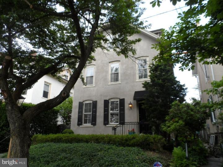 Enjoy the sophisticated elegance of this 4 bedroom 2 bath Chestnut Hill single. Built in the 1870's and remodeled several times with thoughtful updates for today's lifestyle, this gracious home offers exceptional curb appeal, wonderful interior spaces, extra-large living room with custom bookcase, built-ins and exquisite mirrored glass French doors ? perfect for entertaining. It also features a formal dining room with decorative fireplace, first floor laundry/mud room with outside exit and a custom kitchen with cherry cabinets, granite counters and stainless steel appliances. French doors provide access to the fenced rear garden which was professionally landscaped and features mature plantings, flagstone patio and access to the private parking area via a winding brick walkway. There are 4 bedrooms plus a second floor den or family room, a new ceramic tile bath with Jacuzzi tub, first floor powder room and beautiful pine floors throughout. Third floor suite offers potential for au pair or in-law space. This home has been carefully maintained and updated with 200 Amp. electric service, newer roof, new hot water heater and many replacement windows. Extra lot at the back of the property provides access to parking area as well as extra space for additional cars. You'll fall in love with this home's historic charm and period details, wonderful inside and outside entertaining space, sought after Top-of-the-Hill location and its convenience to trains, shops and restaurants with a walk score of 86. Don't miss it!