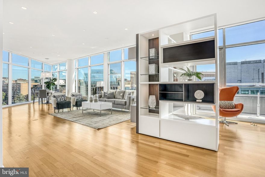 This exceptional upper-floor apartment at the highly sought-after 22West offers a rare opportunity. The D-tier unit features expansive floor-to-ceiling windows throughout, providing breathtaking views. Inside, you'll find a spacious, modern open layout with granite countertops and stainless steel appliances. The apartment also boasts 9'6" ceilings, side-by-side 2-car garage parking (spaces 3038 and 3039), and a large dedicated storage space. Building amenities include 24-hour concierge service, doormen, a rooftop pool, a party room, a grilling area, and a fitness center. The monthly condo fee covers all utilities, including Verizon Fios high-speed internet and cable.