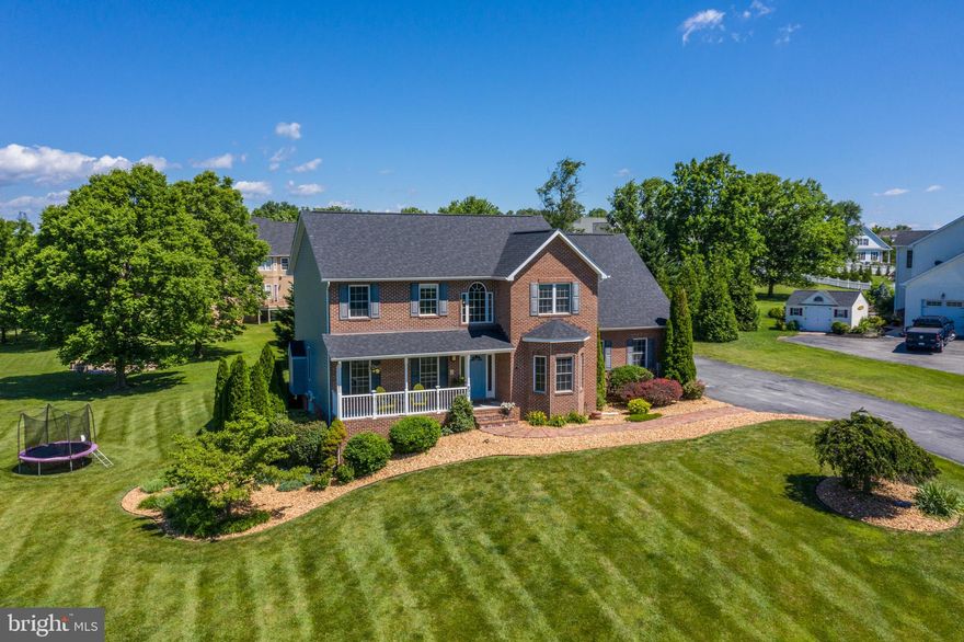 This is a great find in an established, commuter friendly neighborhood.  The brick-front custom home sets beautifully on a spacious lot with mature landscaping, and features a three-car garage, porch and patio.  The interior is very well-maintained and has beautiful hardwood floors through the main level.  An open and flexible floorplan allows for great functionality and the sunroom adds to the warmth of the main floor.  Upstairs you will find four large bedrooms, including a master suite with more than enough space, a large bathroom, and a walk-in closet.  The finished basement has another full bathroom, a large den, and another finished room which can be used as an office, storage room, etc.  New Roof and new siding have been added to this awesome colonial home in Eastland.